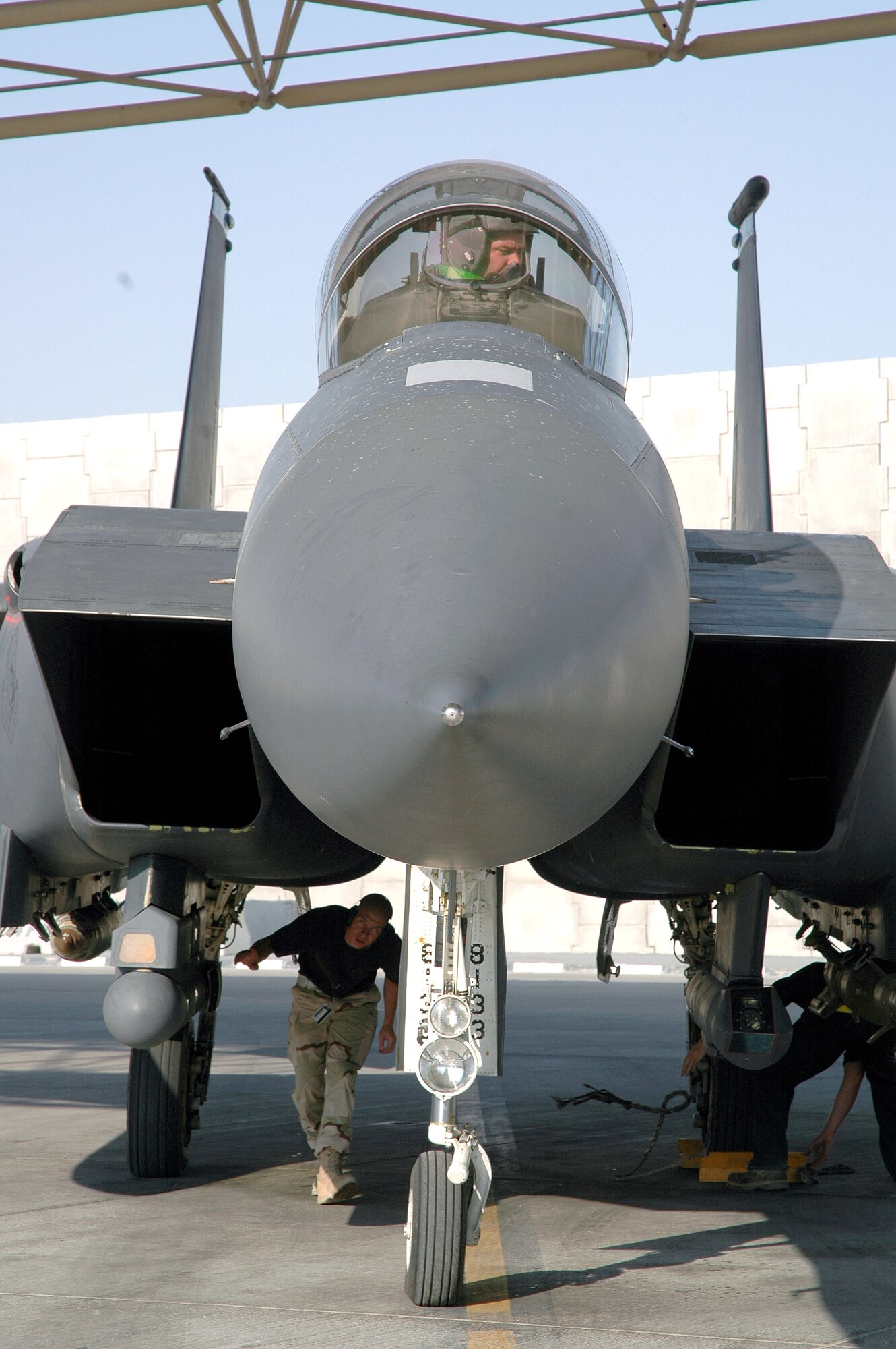 FORWARD DEPLOYED LOCATION (AFPN) -- Maintainers park an F-15E Strike Eagle after a mission over Iraq. The fighter is from the 492nd Expeditionary Fighter Squadron here. (U.S. Air Force photo by Master Sgt. Peter Borys) 