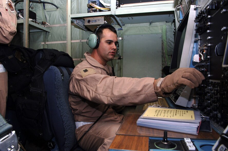BAGRAM AIR BASE, Afghanistan (AFPN) -- Tech. Sgt. Mike Dyson makes final checks on an EC-130H Compass Call before a combat sortie. Sergeant Dyson, a 41st Expeditionary Electronic Combat Squadron mission crew supervisor, deployed from Davis-Monthan Air Force Base, Ariz. Since November 2004, EC-130s have supported more that 1,500 air-support requests from ground forces participating in Operation Enduring Freedom. (U.S. Air Force photo by Capt. James H. Cunningham)