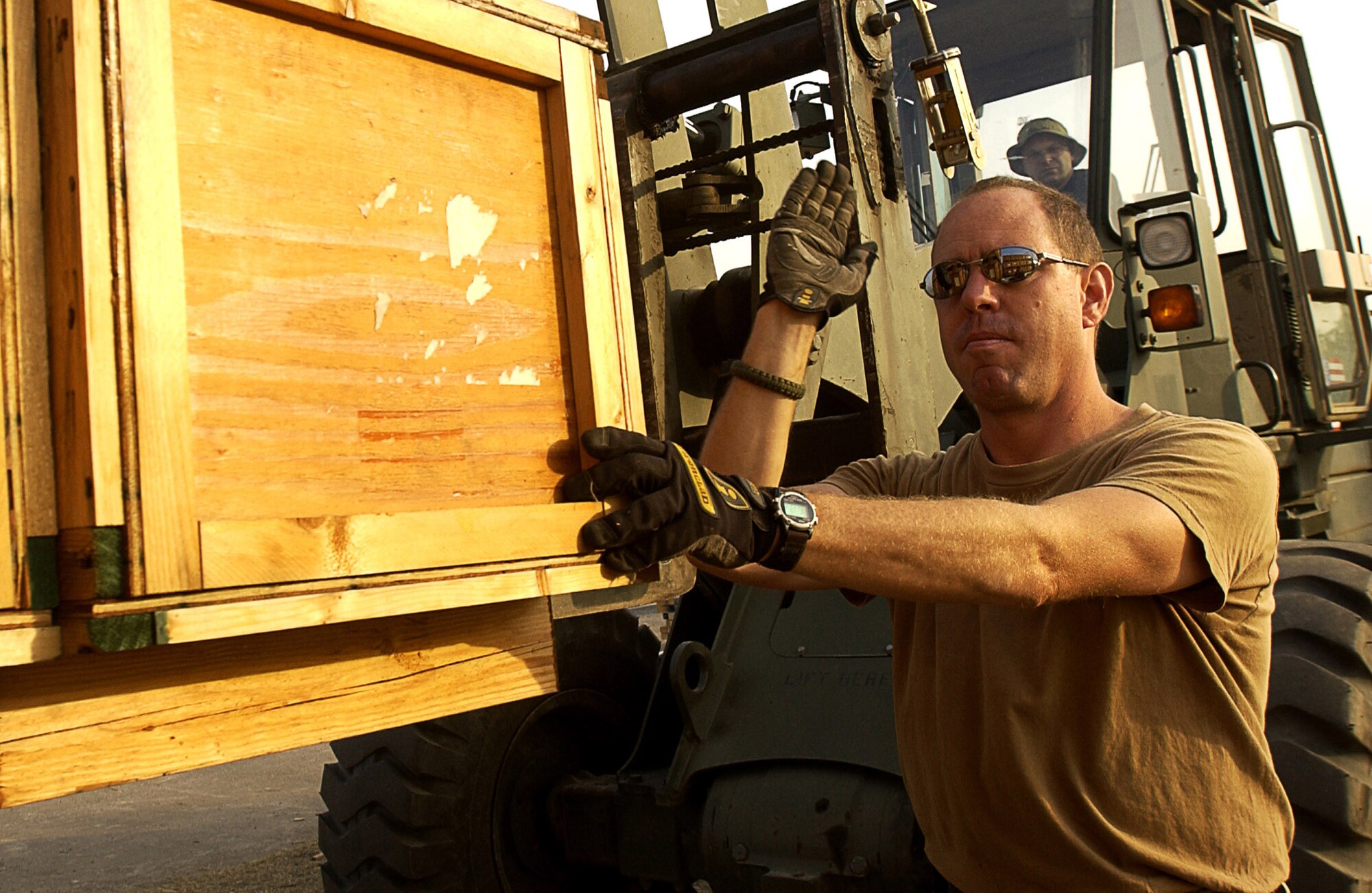 CHAKLALA AIR BASE, Pakistan (AFPN) -- Master Sgt. Perry O'Brien directs a pallet onto a truck here in support of Pakistan earthquake-relief efforts. The pallet was loaded Oct. 26 and will eventually end up in Pakistan in support of earthquake victims there.  Sergeant O'Brien is from the 818th Contingency Response Group at McGuire Air Force Base, N.J. (U.S. Air Force photo by Tech. Sgt. Jeromy  Cross)