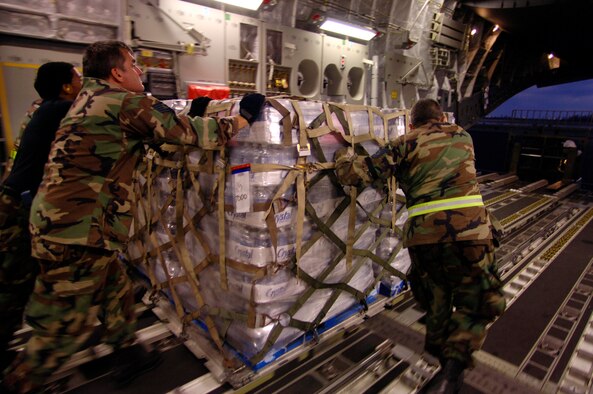 HOMESTEAD AIR RESERVE BASE, Fla. -- Members of the 70th Aerial Port Squadron unload relief aid from a C-17 Globemaster III here Oct. 27.  (U.S. Air Force photo by Staff Sgt. Jacob N. Bailey)
