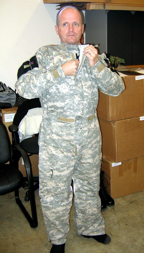 MOODY AIR FORCE BASE, Ga. -- Col. John Decknick tries on the new chemical warfare suit. The 820th Security Forces Group commander tried on the suit Oct. 24. The 820th SFG is the first military unit to perform tests on several components of the new chemical warfare suit. (U.S. Air Force photo by Airman Eric Schloeffel)