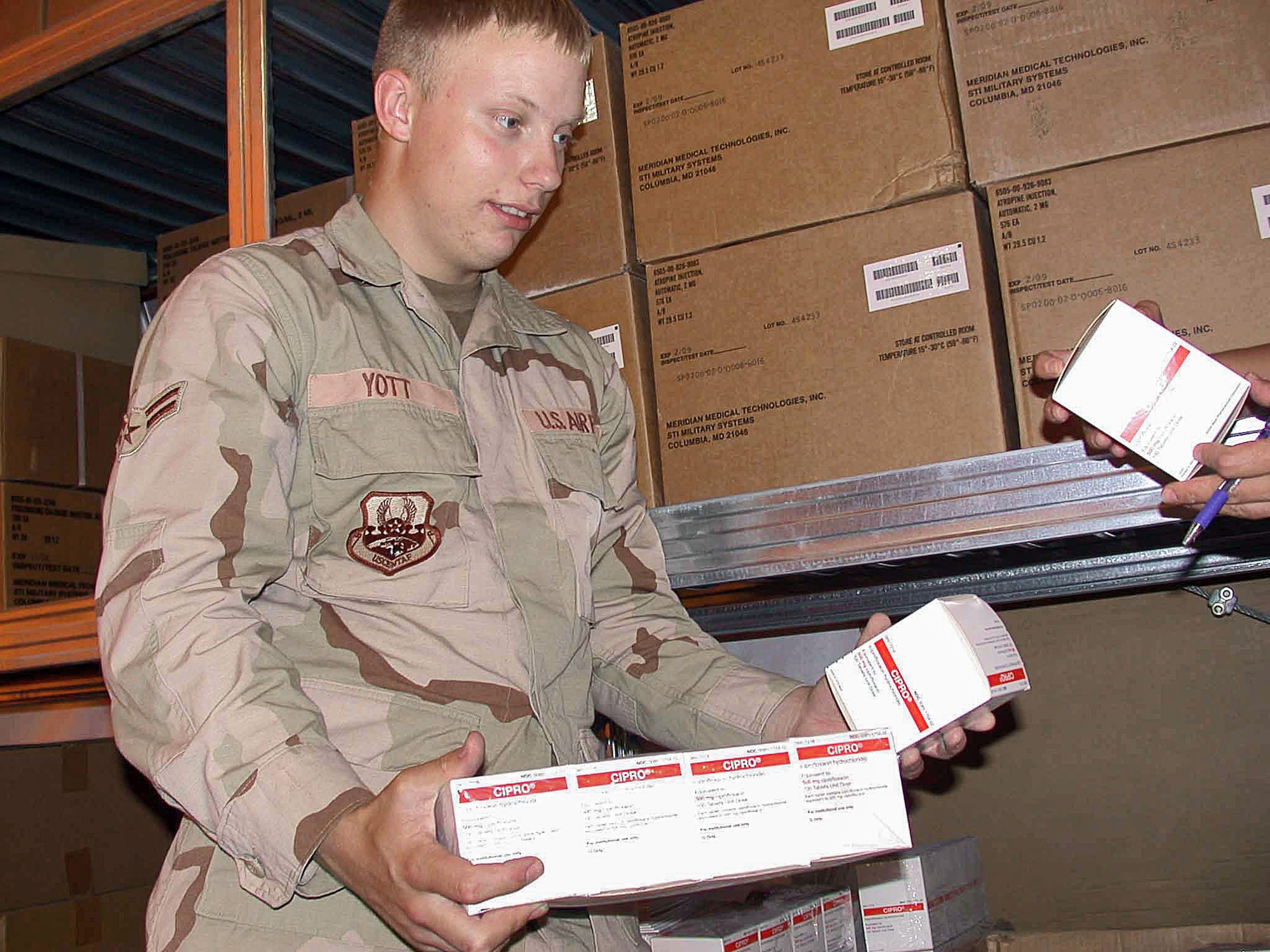 SOUTHWEST ASIA (AFPN) -- Airman 1st Class Samuel Yott, 379th Expeditionary Medical Squadron medical logistics technician, checks the expiration date and lot numbers on a medical item. The 379th EMEDS medical logistics flight maintains more than $200,000 worth of medical supplies and $2.3 million worth of medical equipment. (U.S. Air Force photo by Staff Sgt. Alicia Prakash) 