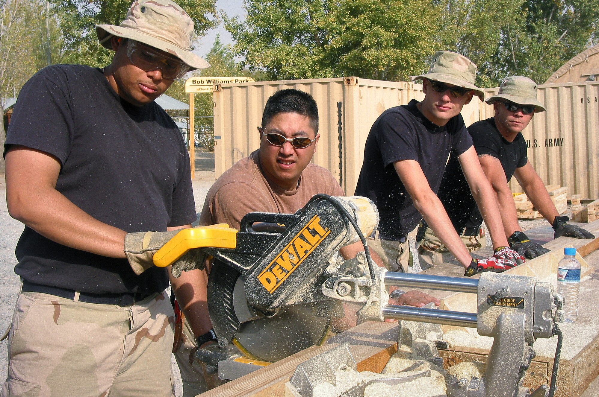 MANAS AIR BASE, Kyrgyzstan -- Members of the 5th Combat Communications Group, Robins Air Force Base, Ga., help out with a playground project to benefit the Childrens Cancer Center in Bishkek, Kyrgyzstan, on Oct. 25.  The 5th CCG arrived at Manas Air Base on Oct. 21 to stage and prepare for possible forward deployment to Pakistan to aid in earthquake relief efforts. (U.S. Air Force photo by Master Sgt. Lisa Polarek)
