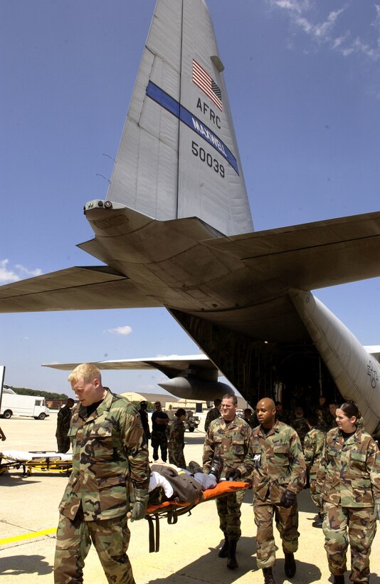 ANDREWS AIR FORCE BASE, Md. -- Airmen with the 908th Airlift Wing at Maxwell Air Force Base, Ala., the 375th Aeromedical Evacuation Squadron at Scott AFB, Ill., and the 89th Medical Group here help transport veterans from the Armed Forces Home in Gulfport, Miss., after Hurricane Katrina decimated the area. The veterans were flown by a C-130 Hercules from Maxwell to here where they were then taken to the Armed Forces Home in Washington, D.C. (U.S. Air Force photo by Staff Sgt. Christopher J. Matthews)