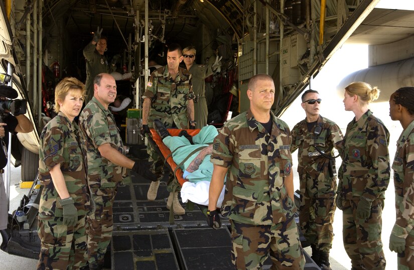 ANDREWS AIR FORCE BASE, Md. - A passenger is carried from a C-130 Hercules by Airmen who transported veterans from the Armed Forces Home in Gulfport, Miss. after Hurricane Katrina decimated the area. The veterans were flown by a C-130 Hercules from Maxwell to here where they were taken to the Armed Forces Home in Washington, D.C. (U.S. Air Force photo by Staff Sgt. Christopher J. Matthews)