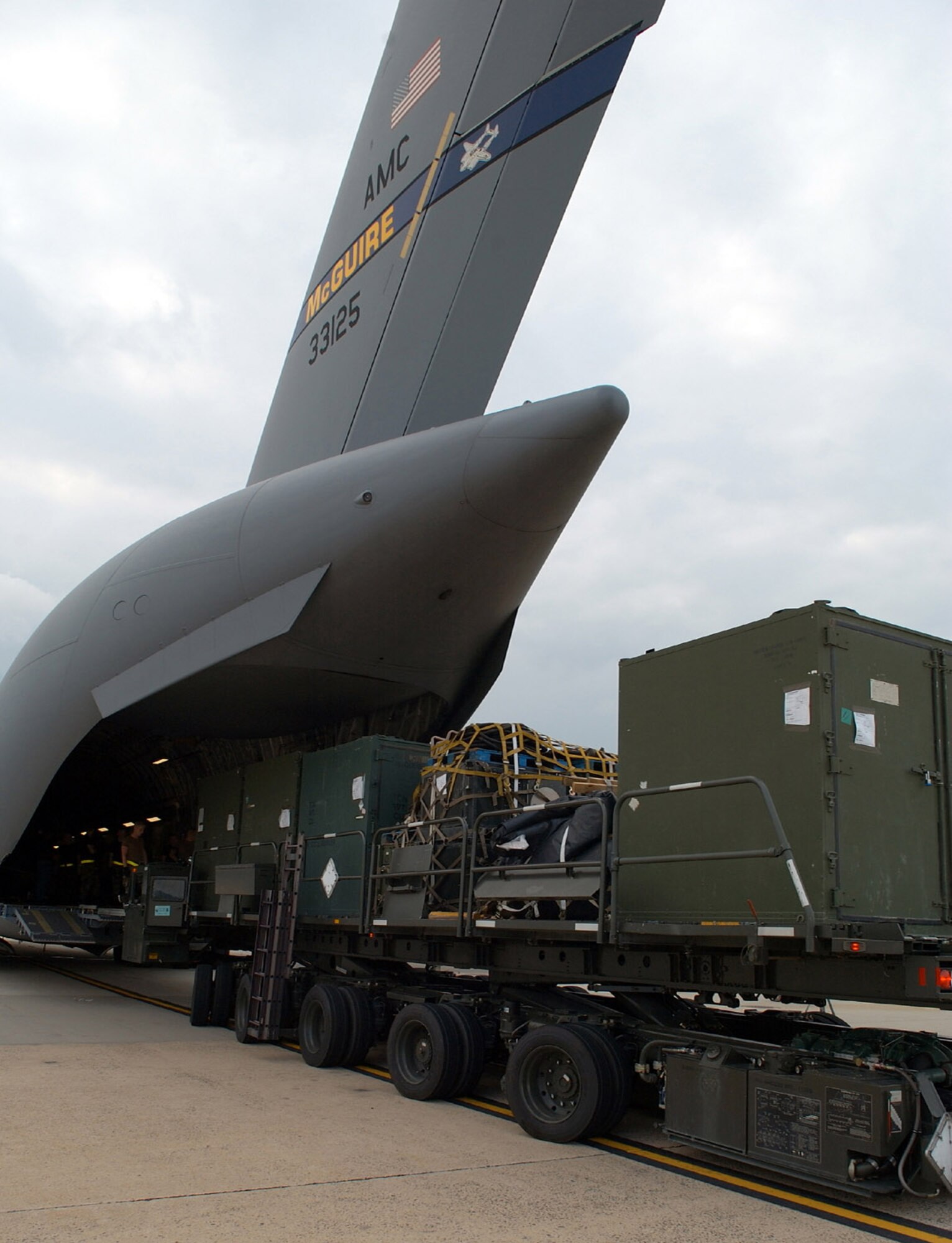 MCGUIRE AIR FORCE BASE, N.J. -- Equipment headed for New Orleans International Airport to assist in the Hurricane Katrina relief effort is loaded onto a C-17 Globemaster III by Airmen with the 305th Aerial Port Squadron here Aug. 31. Twenty-nine Airmen from the 819th Global Support Squadron and 110,000 pounds of equipment departed for the region. The 819th GSS trains and rapidly deploys Airmen to quickly open airfields in remote locations extending Air Mobility Command's ability to deploy people and equipment worldwide. (U.S. Air Force photo by Kenn Mann)