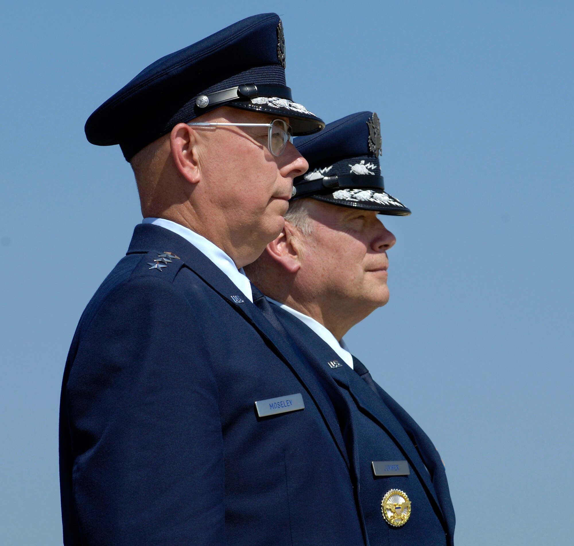 ANDREWS AIR FORCE BASE, Md. - Incoming Air Force Chief of Staff Gen. T. Michael Moseley (left) and outgoing Air Force Chief of Staff Gen. John P. Jumper watch as Air Force troop formations pass in review during a ceremony here Sept. 2.  General Jumper served in the Air Force for 39 years. General Moseley served as Air Force vice chief of staff before being sworn in as the 18th Air Force chief of staff.  (U.S. Air Force photo by Master Sgt. Jim Varhegyi)