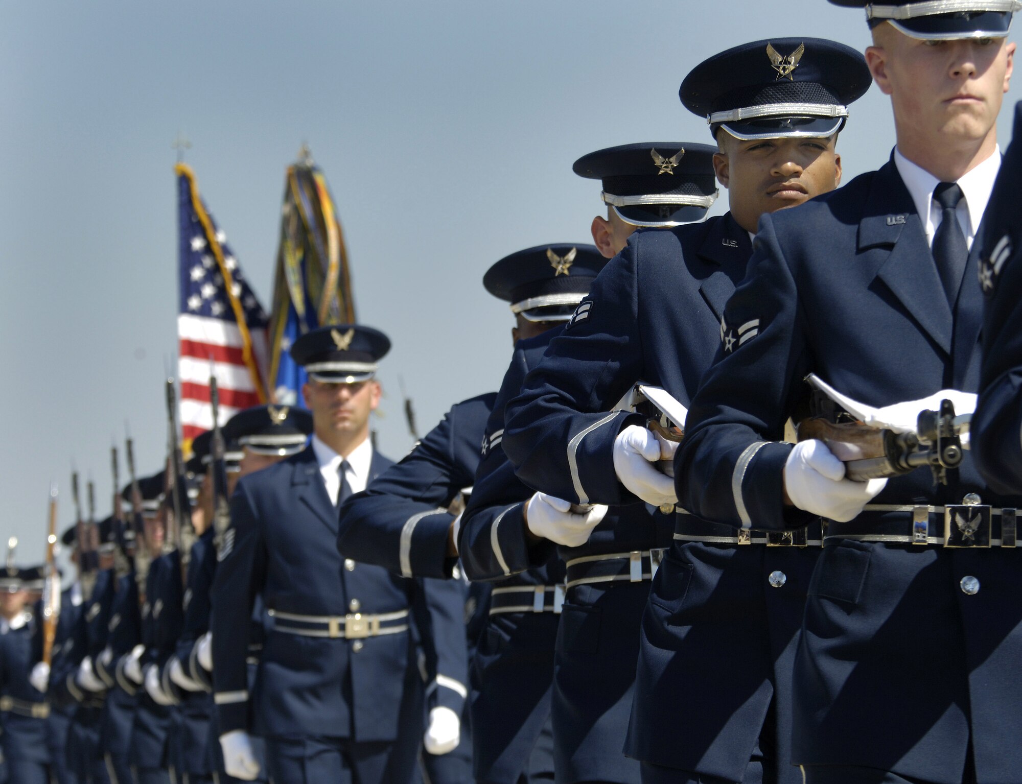 ANDREWS AIR FORCE BASE, Md. -- Flights of U.S. Air Force Honor Guard pass in review for outgoing Air Force Chief of Staff Gen. John P. Jumper and incoming Air Force Chief of Staff Gen. T. Michael Moseley during a ceremony here Sept. 2.  General Jumper served in the Air Force for 39 years.  General Moseley has served as Air Force vice chief of staff.  (U.S. Air Force photo by Master Sgt. Jim Varhegyi)