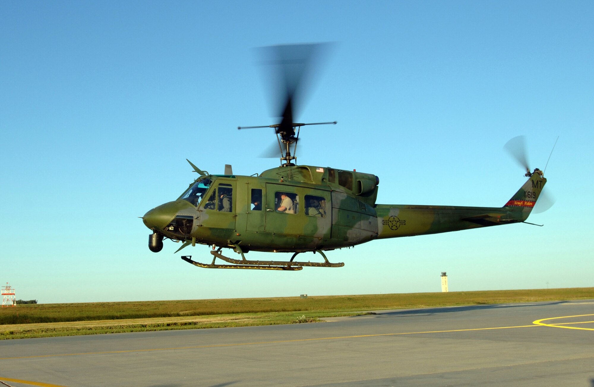 MINOT AIR FORCE BASE, N.D. -- A UH-1N Huey helicopter takes off here Sept. 2 for Columbus Air Force Base, Miss., to assist in the Hurricane Katrina disaster relief efforts.  Thirteen people and a helicopter from the 54th Helicopter Flight here are deploying to aid the recovery.  (U.S. Air Force photo by Staff Sgt. Joe Laws) 
