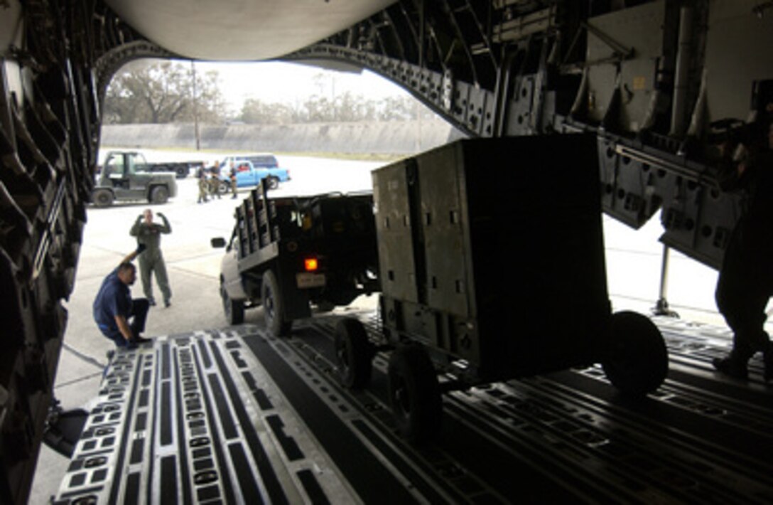 U.S. Air Force personnel off load a generator from a C-17 Globemaster III aircraft at Keesler Air Force Base, Miss., on Sept. 1, 2005. Department of Defense units are mobilized as part of Joint Task Force Katrina to support the Federal Emergency Management Agency's disaster-relief efforts in the Gulf Coast areas devastated by Hurricane Katrina. 