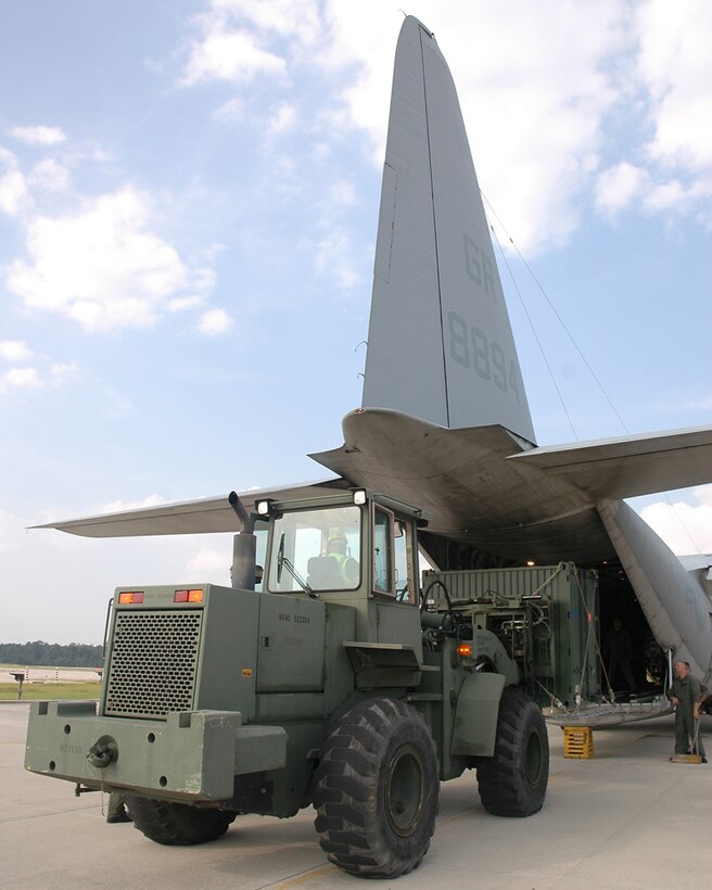 Marines from Marine Aerial Refueler Transport Training Squadron 253 load containers aboard a C-130 Hercules before flying troops to Louisiana in aid of Joint Task Force Katrina.  The Marines will provide support to the areas affected by Hurricane Katrina.