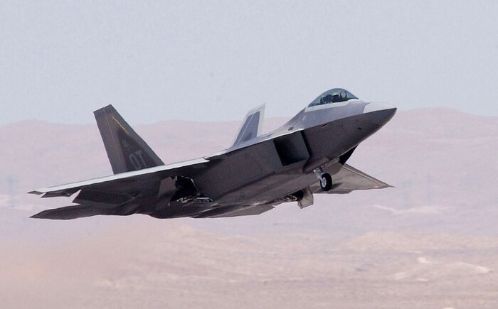 NELLIS AIR FORCE BASE, Nev. -- An F/A-22 Raptor takes off from here for a mission. During a two-ship sortie, Airmen from the 422nd Test and Evaluation Squadron flew the first Follow-on Operational Test and Evaluation mission on the F/A-22 Raptor on Aug. 29, releasing Joint Direct Attack Munitions on the Utah Test and Training Range. (U.S. Air Force photo by Tech.Sgt. Kevin J. Gruenwald)