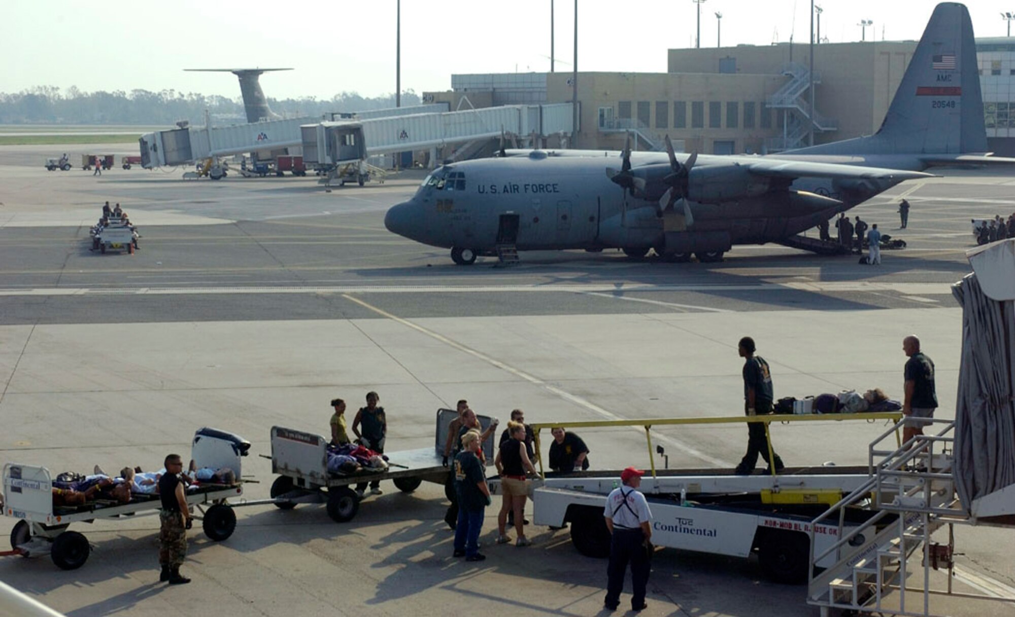 NEW ORLEANS -- Elderly patients are moved to awaiting aircraft for evacuation from here Sept. 3.  More than 2,000 patients have been evacuated since operations began. (U.S. Air Force photo by Master Sgt Jack Braden)