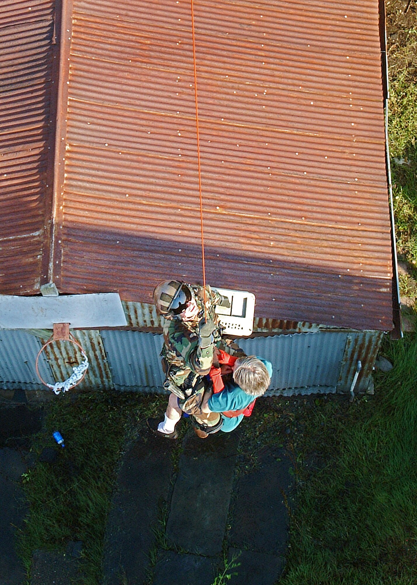 NEW ORLEANS -- Hoisted aloft from roof tops and carried aboard from broken bridge spans and other locations isolated by flooding waters, more than 2,000 people have been saved by reservists and active duty pararescue teams in the past five days.  (Air Force photo by Master Sgt. Bill Huntington)