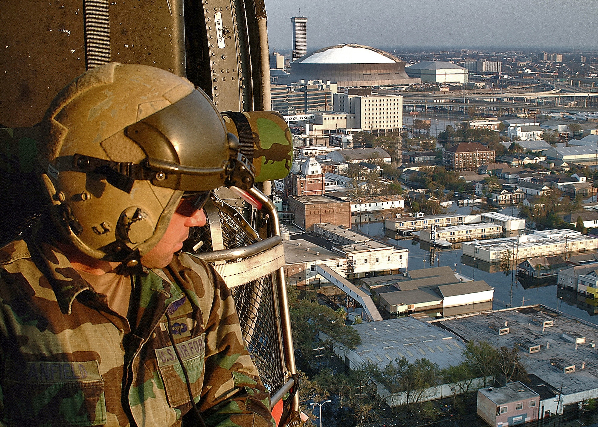 NEW ORLEANS -- With a combined force of 26 helicopters and about 400 people, pararescue teams composed of reservists and active duty Airmen are flying 8- to 10-hour missions over New Orleans' flooded city to save lives.  Rescuing more than 2,000 people in five days, the pararescue teams locate and retrieve the residents, drop them off at a collection point, and then circle around again looking for more.  (Air Force photo by Master Sgt. Bill Huntington)
