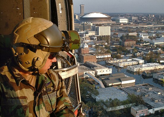NEW ORLEANS -- With a combined force of 26 helicopters and about 400 people, pararescue teams composed of reservists and active duty Airmen are flying 8- to 10-hour missions over New Orleans' flooded city to save lives.  Rescuing more than 2,000 people in five days, the pararescue teams locate and retrieve the residents, drop them off at a collection point, and then circle around again looking for more.  (Air Force photo by Master Sgt. Bill Huntington)