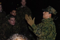 Gunnery Sgt. Ilein Taipe, an Officer Candidate School platoon sergeant, gives her platoon of officer candidates a briefing on what's in store for them during the 9th Marine Corps District's OCS Preparatory Weekend April 11 at Fort McCoy, Wis. Taipe was one of four platoon sergeants who helped bring a taste of OCS to nearly 200 candidates