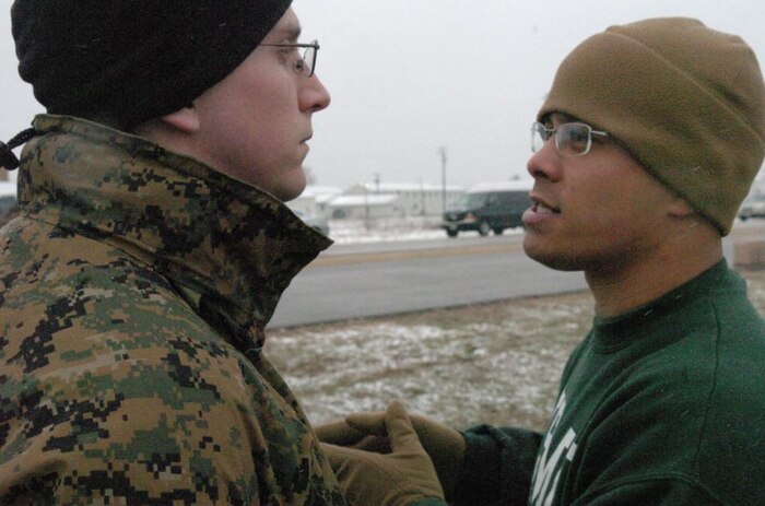 Gunnery Sgt. Avery Cruz, an Officer Candidate School platoon sergeant, gives guidance to his candidate platoon sergeant during the 9th Marine Corps District's OCS Preparatory Weekend April 12 at Fort McCoy, Wis. Cruz was one of four platoon sergeants to help bring a taste of OCS to nearly 200 candidates. The preview let candidates experience the yelling of platoon sergeants, running a physical fitness test in harsh conditions and finding their way through a land navigation course.