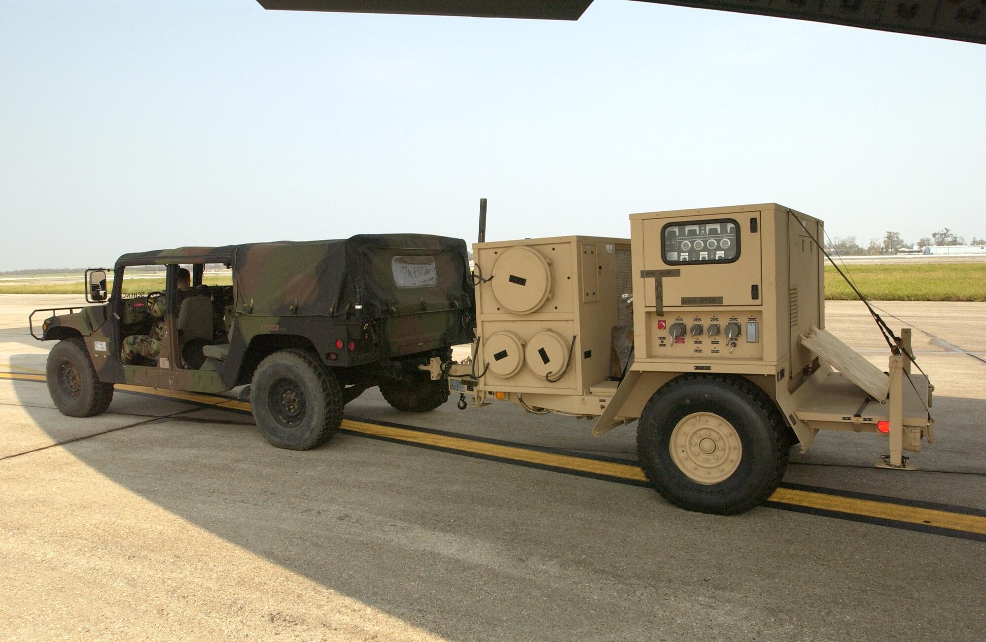 LOUIS ARMSTRONG NEW ORLEANS INTERNATIONAL AIRPORT, La. -- Equipment for the U.S. Army's 82nd Airborne Division arrives Sept. 5 to support hurricane relief efforts here.  Airmen with the 818th Contingency Response Group from McGuire Air Force Base, N.J., helped process the equipment and unload it from the aircraft.  (U.S. Air Force photo by Master Sgt. Michael E. Best)  