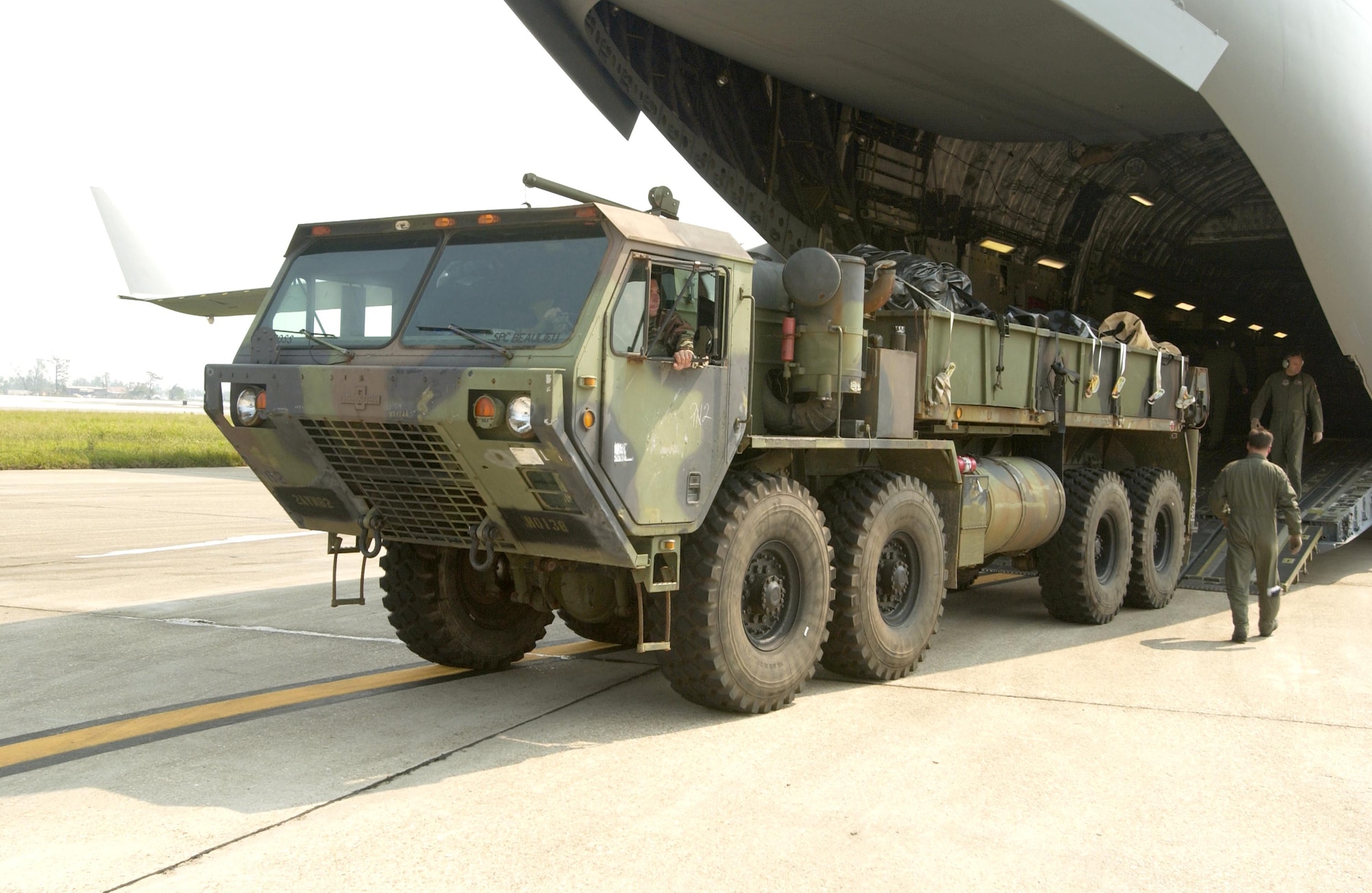 LOUIS ARMSTRONG NEW ORLEANS INTERNATIONAL AIRPORT, La. -- Equipment for the U.S. Army's 82nd Airborne Division arrives Sept. 5 to support hurricane relief efforts here.  Airmen with the 818th Contingency Response Group from McGuire Air Force Base, N.J., helped process the equipment and unload it from the aircraft.  (U.S. Air Force photo by Master Sgt. Michael E. Best)  