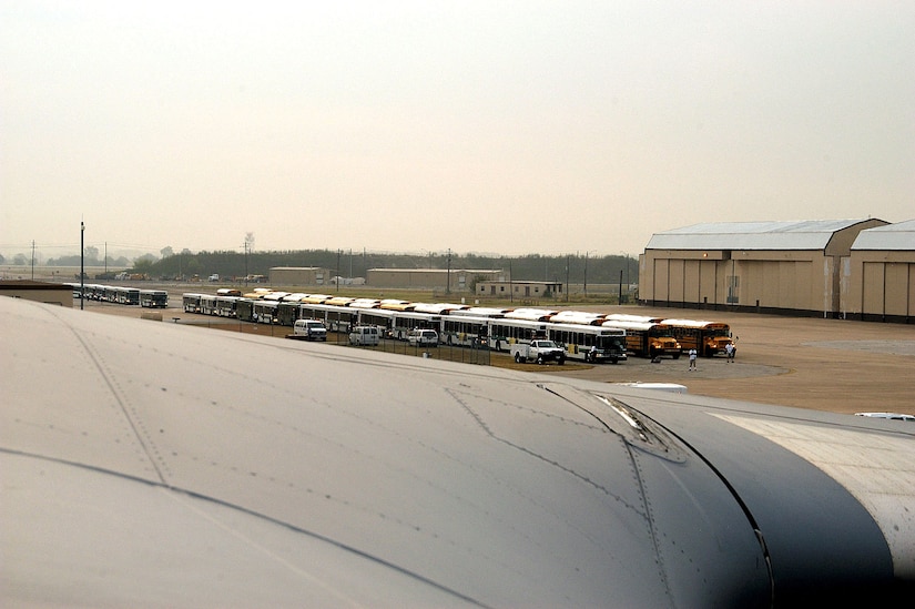 AUSTIN, Texas -- Dozens of buses line up outside awaiting an arriving C-17 Globemaster III aircraft carrying evacuees from New Orleans who are victims of flooding caused by Hurricane Katrina.  Here, the evacuees were given food, fresh water and a place to sleep.  (U.S. Air Force photo by 1st Lt. Neil Senkowski)  