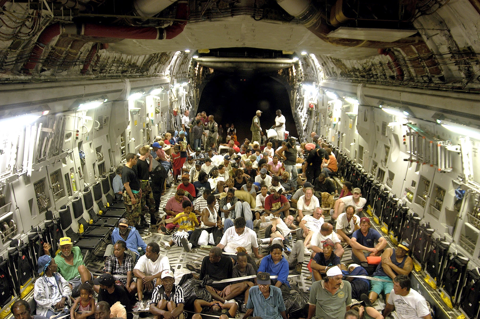 ONBOARD A C-17 GLOBEMASTER III -- More than 140 evacuees from New Orleans, victims of flooding caused by Hurricane Katrina, flew to Austin, Texas.  There, they were given food, fresh water and a place to sleep.  (U.S. Air Force photo by 1st Lt. Neil Senkowski)  