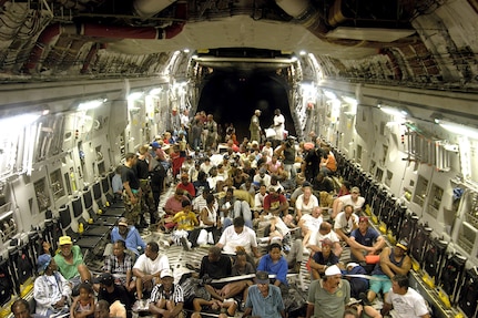 ONBOARD A C-17 GLOBEMASTER III -- More than 140 evacuees from New Orleans, victims of flooding caused by Hurricane Katrina, flew to Austin, Texas.  There, they were given food, fresh water and a place to sleep.  (U.S. Air Force photo by 1st Lt. Neil Senkowski)  