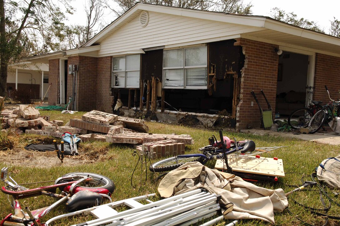 KEESLER AIR FORCE BASE, Miss. -- Personal belongings and parts of walls are strewn about the backyard of a home on the perimeter of the Bay Ridge housing area here. Hurricane Katrina's high winds and storm surge downed trees, engulfed homes in debris and destroyed houses in the area. (U.S. Air Force photo by Joe Piccorossi)