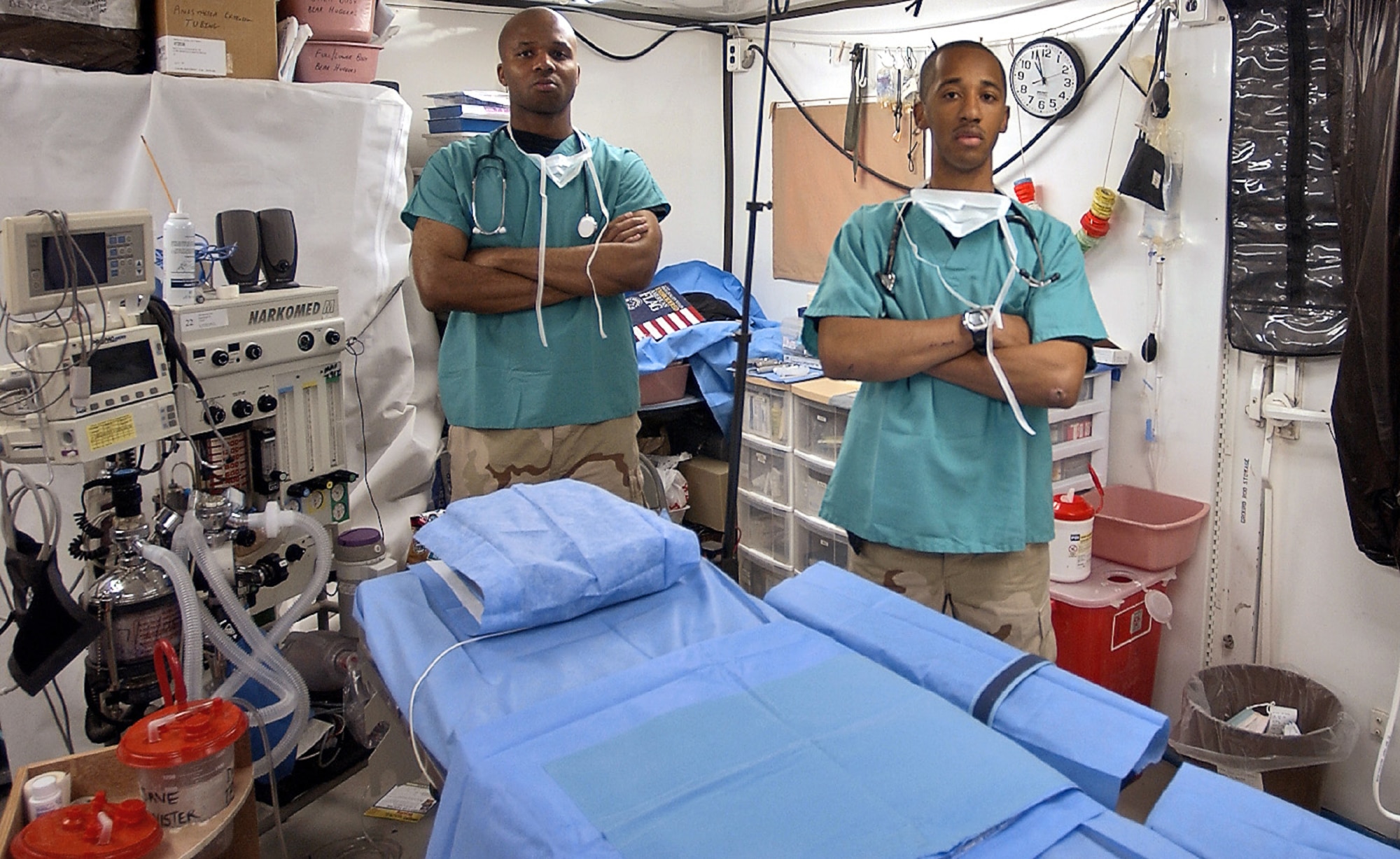 BAGHDAD, Iraq -- Staff Sgts. Bobby Lawson (left) and Charles Berry, along with the doctors, nurses and other medics with the 447th Expeditionary Medical Squadron here have treated more than 3,000 patients during the past five months.  Sergeants Berry and Lawson are deployed from Maxwell Air Force Base, Ala.  (U.S. Air Force photo by Tech. Sgt. Brian Davidson)