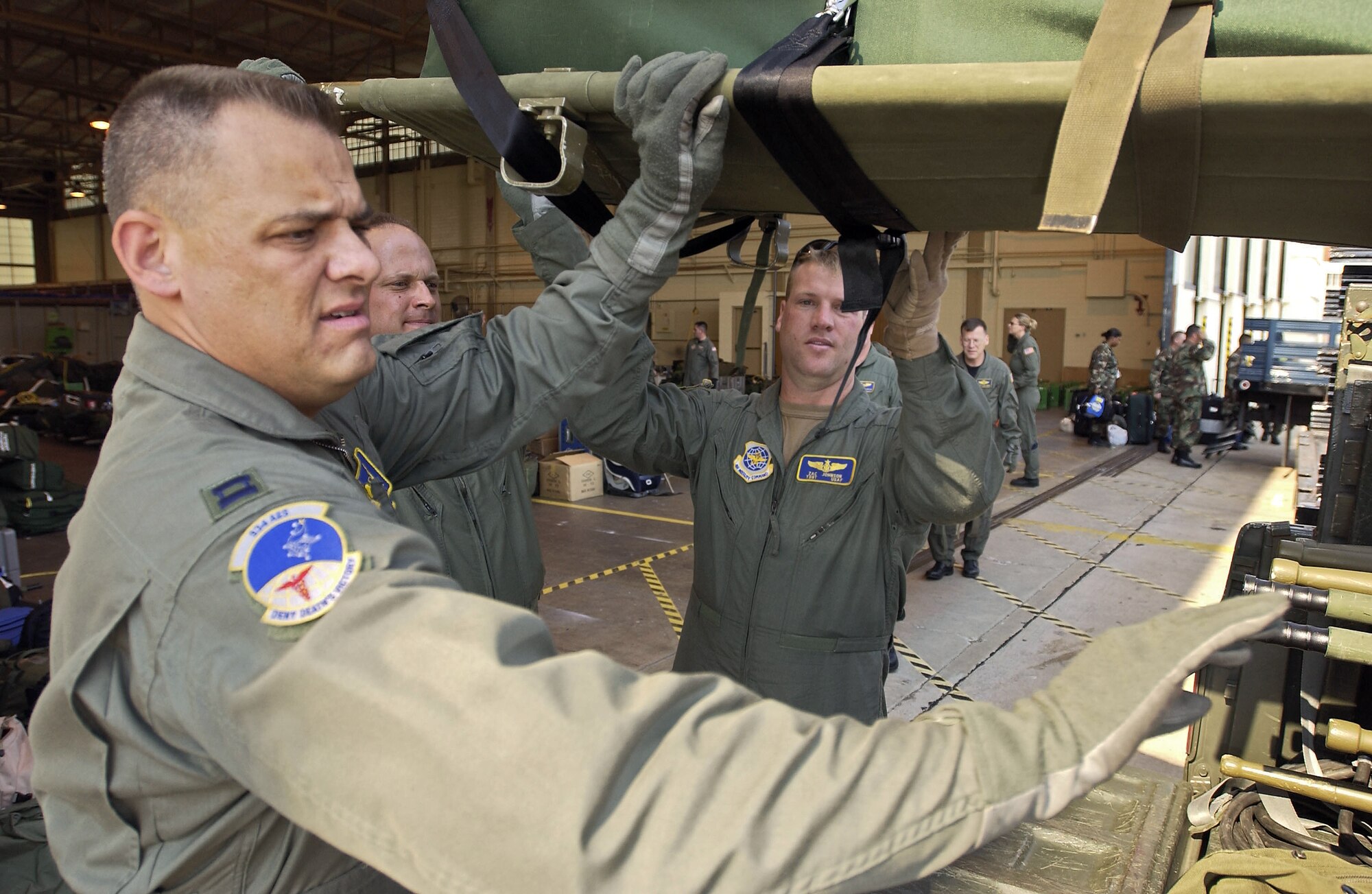 SAN ANTONIO -- Airmen with the 934th Aeromedical Evacuation Squadron lift a litter into a truck before leaving here on a mission to the Gulf Coast. The Airmen from the 934th AES comprised an aeromedical evacuation team that flew from Texas to New Orleans, later dropping patients off at locations nationwide. (U.S. Air Force photo by Tech. Sgt. Jason Tudor)