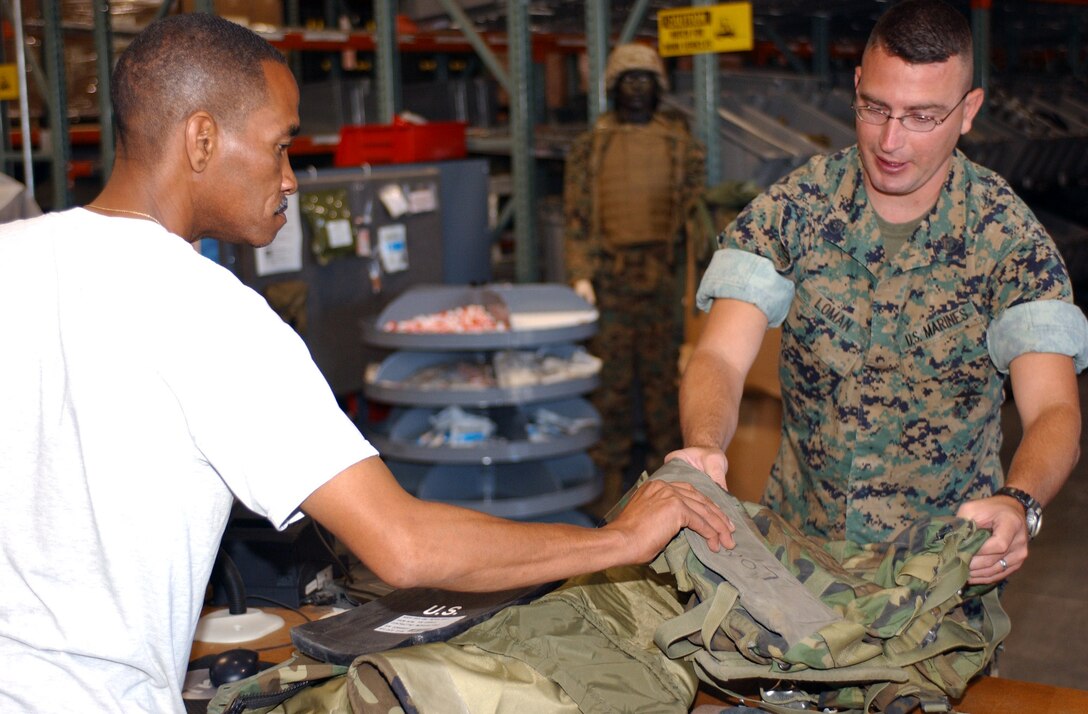 CAMP PENDLETON, Calif. (Sept. 8, 2005) - Sgt. Thomas Ryan McMickle, the assistant radio chief for the 15th Marine Expeditionary Unit, and Oak Harbor, Wash. native, grits his teeth as he defeats another opponent on his way to a 1st place trophy in the Commanding General's Cup Arm Wrestling Tournament.  (Official USMC photo by Cpl. Scott L. Eberle)