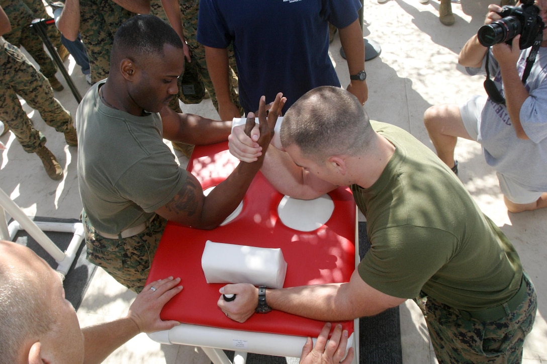CAMP PENDLETON, Calif. (Sept. 8, 2005) - Sgt. Shannon R. Haynes (left), and Sgt. Thomas Ryan McMickle, both members of the 15th Marine Expeditionary Unit, establish their grip for a match in the Commanding General's Cup Arm Wrestling Tournament. McMickle defeated Haynes and went on to win 1st place while Haynes finished in 3rd place.  (Official USMC photo by Cpl. Scott L. Eberle)
