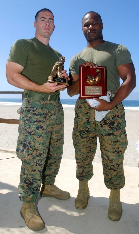 CAMP PENDLETON, Calif. (Sept. 8, 2005) - Sgt. Shannon R. Haynes (right), and Sgt. Thomas Ryan McMickle, both members of the 15th Marine Expeditionary Unit, hold their trophies from the Commanding General's Cup Arm Wrestling Tournament. McMickle finished in 1st place while Haynes finished in 3rd.  (Official USMC photo by Cpl. Scott L. Eberle)