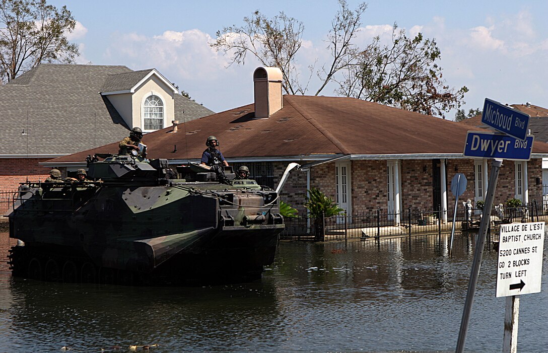 NEW ORLEANS (Sep. 8, 2005) - Amphibious assault vehicles from 4th Amphibious Assault Battalion and infantrymen from Bravo Company, 1st Battalion, 8th Marine Regiment patrol the streets of Orleans Parish to conduct search and rescue.