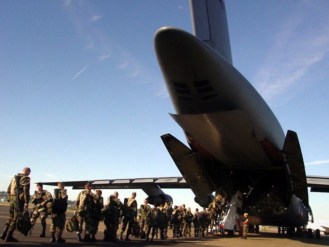 PORTLAND INTERNATIONAL AIRPORT, Ore. -- Oregon Army National Guard Soldiers board a KC-135 Stratotanker from the Illinois Air National Guard's 126th Air Refueling Wing. The aircraft will take the Soldiers to support hurricane-relief efforts in Louisiana. Air Force reservists with the 939th Air Refueling Wing here are providing around-the-clock support to airlift the Soldiers. (U.S. Air Force photo by Ruby Zarzyczny)