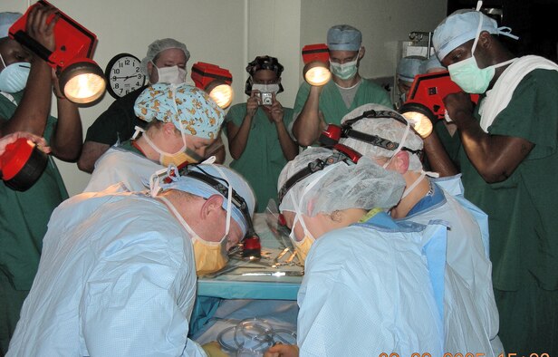 KEESLER AIR FORCE BASE, Miss. -- Industrial flashlights were used to illuminate the surgical field for a baby's delivery by C-section just after the peak of Hurricane Katrina had passed.  (U.S. Air Force photo by Maj. Betsy Majma)