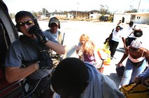 NEW ORLEANS -- A U.S. pararescueman from the 38th Rescue Squadron at Moody Air Force Base, Ga., helps load evacuees aboard an HH-60G Pave Hawk helicopter.  Once rescued, all the evacuees are flown to the rescue operations main collection center located at the New Orleans airport.  (U.S. Air Force photo by Master Sgt. Efrain Gonzalez)