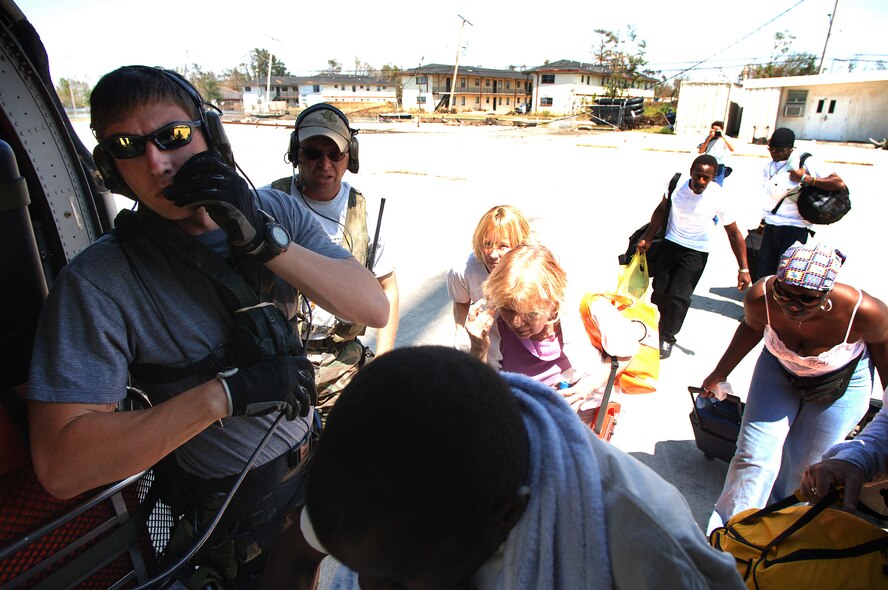 NEW ORLEANS -- A U.S. pararescueman from the 38th Rescue Squadron at Moody Air Force Base, Ga., helps load evacuees aboard an HH-60G Pave Hawk helicopter.  Once rescued, all the evacuees are flown to the rescue operations main collection center located at the New Orleans airport.  (U.S. Air Force photo by Master Sgt. Efrain Gonzalez)