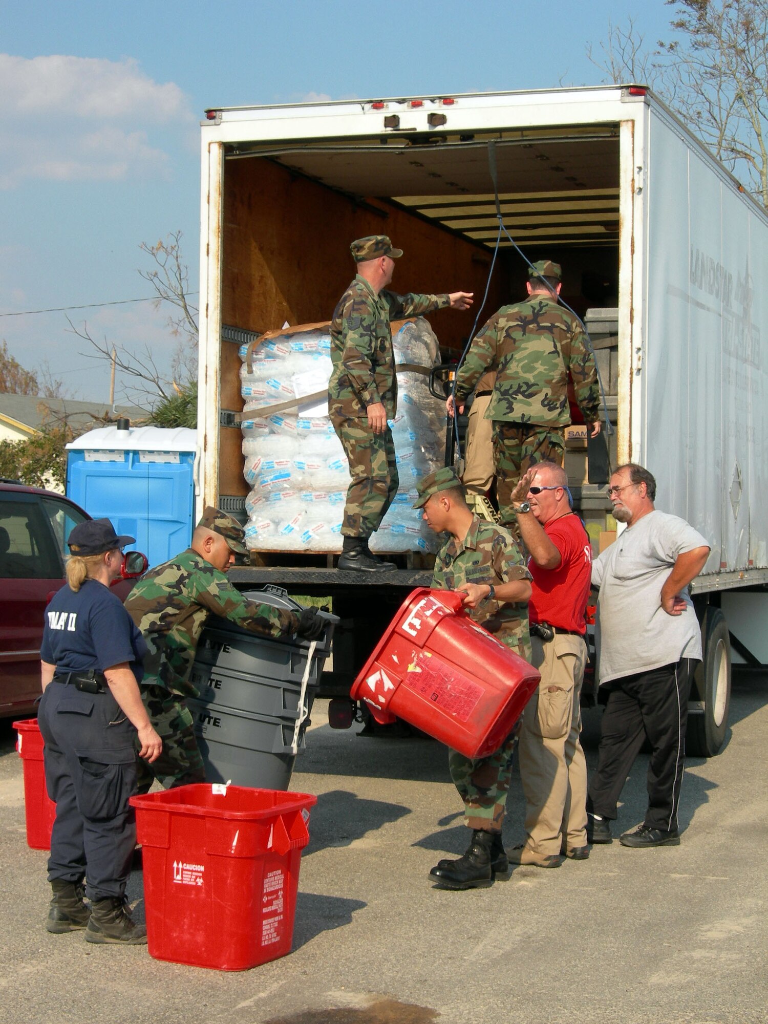MISSISSIPPI -- A group of Airmen with the 97th Air Expedtionary Group helps unload medical supplies at one of the Federal Emergency Management Agency's medical assistance team locations along the Gulf Coast.  The group, comprising Airmen throughout the United States who began arriving at nearby Keesler Air Force Base on Sept. 6, was established to provide humanitarian assistance to those affected by Hurricane Katrina.  (U.S. Air Force photo)