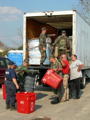 MISSISSIPPI -- A group of Airmen with the 97th Air Expedtionary Group helps unload medical supplies at one of the Federal Emergency Management Agency's medical assistance team locations along the Gulf Coast.  The group, comprising Airmen throughout the United States who began arriving at nearby Keesler Air Force Base on Sept. 6, was established to provide humanitarian assistance to those affected by Hurricane Katrina.  (U.S. Air Force photo)