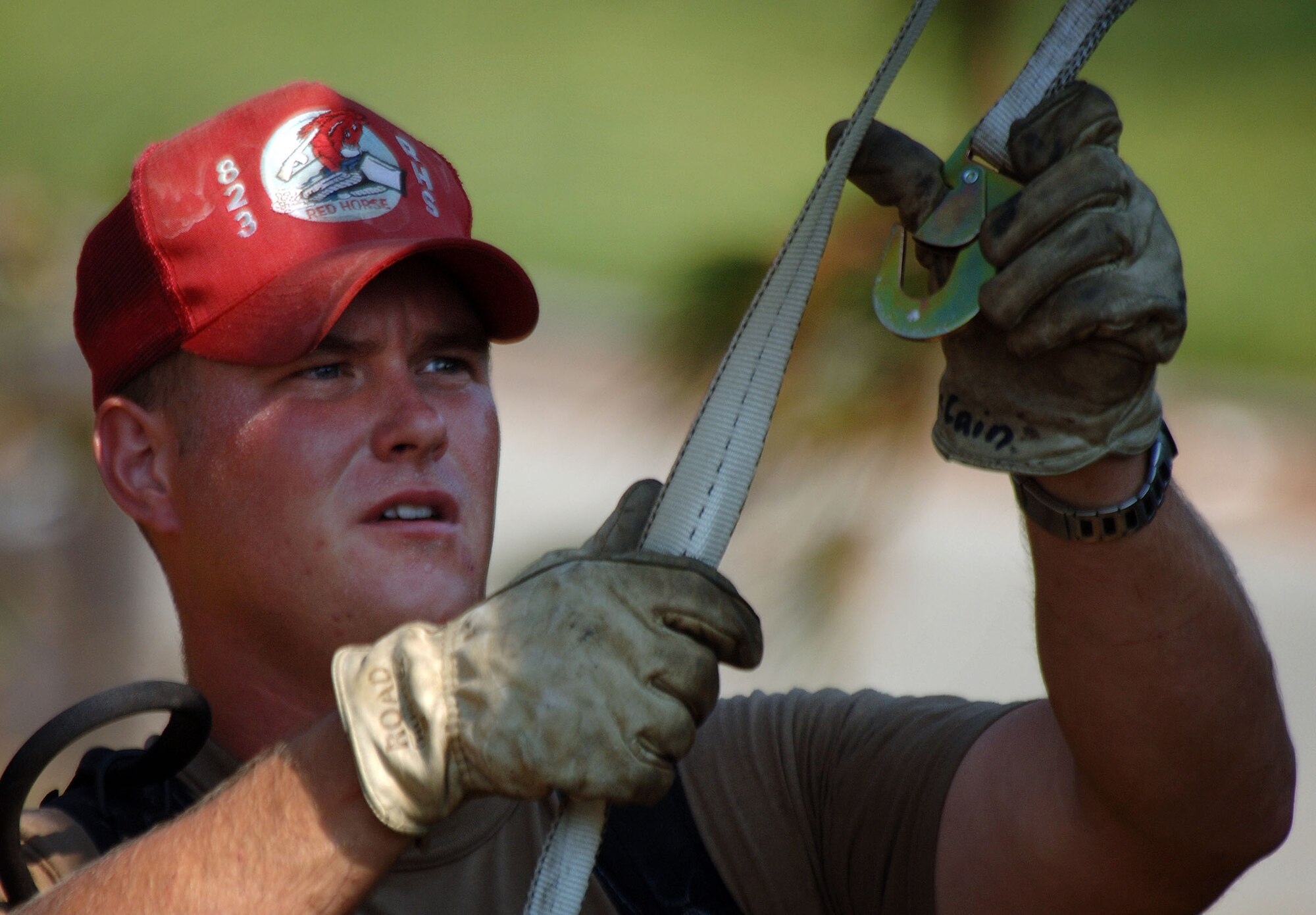 KEESLER AIR FORCE BASE, Miss. -- Staff Sgt. Jamey McCain helps clear and remove fallen trees from the base housing area here.  More than 90 Airmen from the 823rd Red Horse Squadron at Hurlburt Field, Fla., are deployed here to help with the base's hurricane recovery effort.  (U.S. Air Force photo by Master Sgt. Efrain Gonzalez)