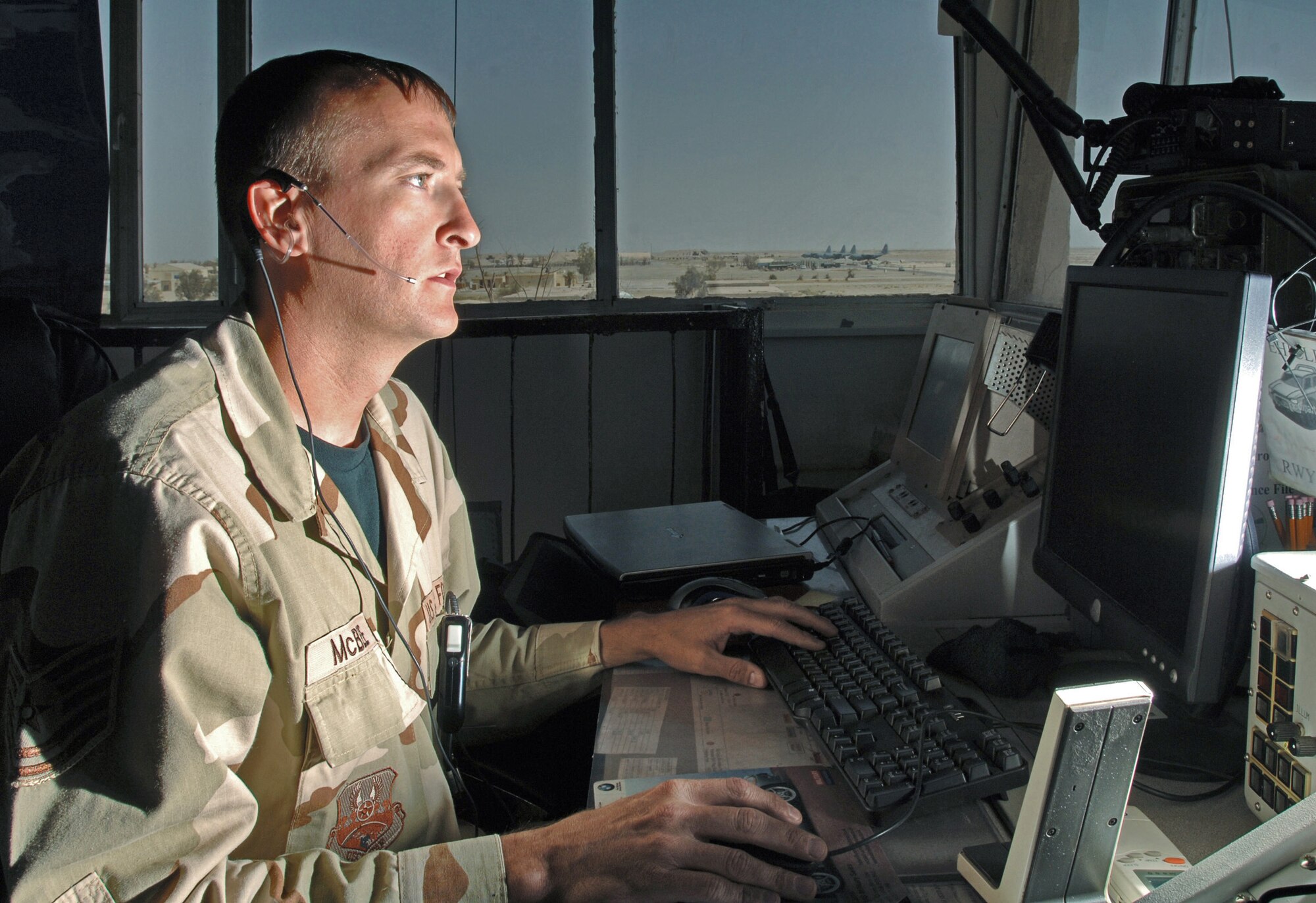 ALI BASE, Iraq -- Tech. Sgt. Chad McBee checks local weather to relay to a pilot. Sergeant McBee is a tower controller with the 407th Expeditionary Operations Support Squadron and is deployed from Pope Air Force Base, N.C. (U.S. Air Force photo by Master Sgt. Maurice Hessel)