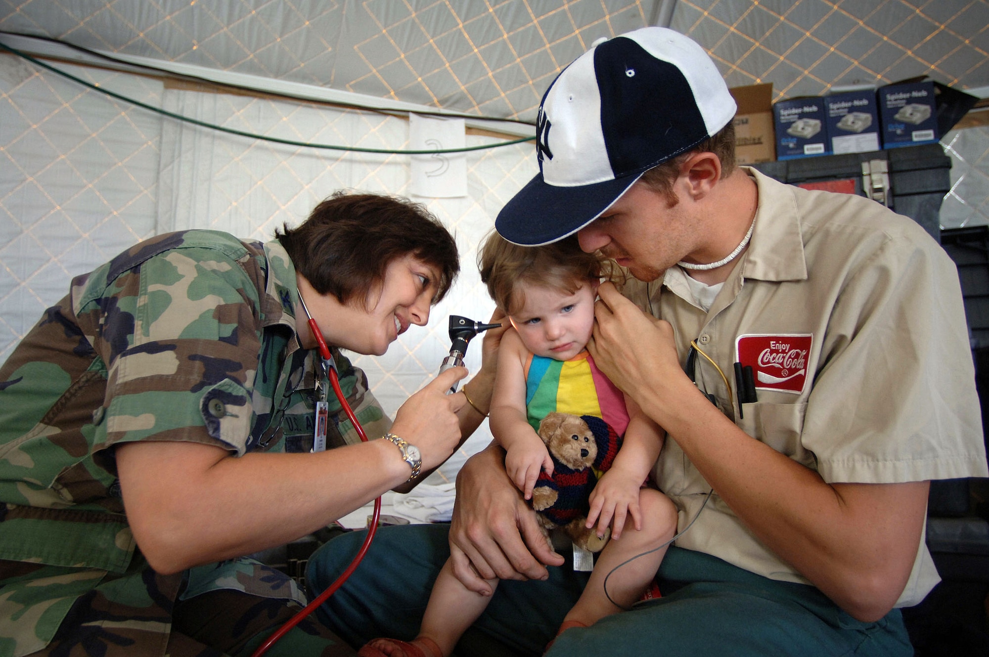 GULFPORT, Miss. -- Col. (Dr.) Ann Farash treats 19-month-old Alexia at a treatment facility set up outside the Garden Park Medical Center hospital here.  Dr. Farash, a pediatrician, and other medical providers with the 81st Medical Group from nearby Keesler Air Force Base are working with the Federal Emergency Management Agency to provide medical care to victims of Hurricane Katrina.  (U.S. Air Force photo by Master Sgt. Efrain Gonzalez) 