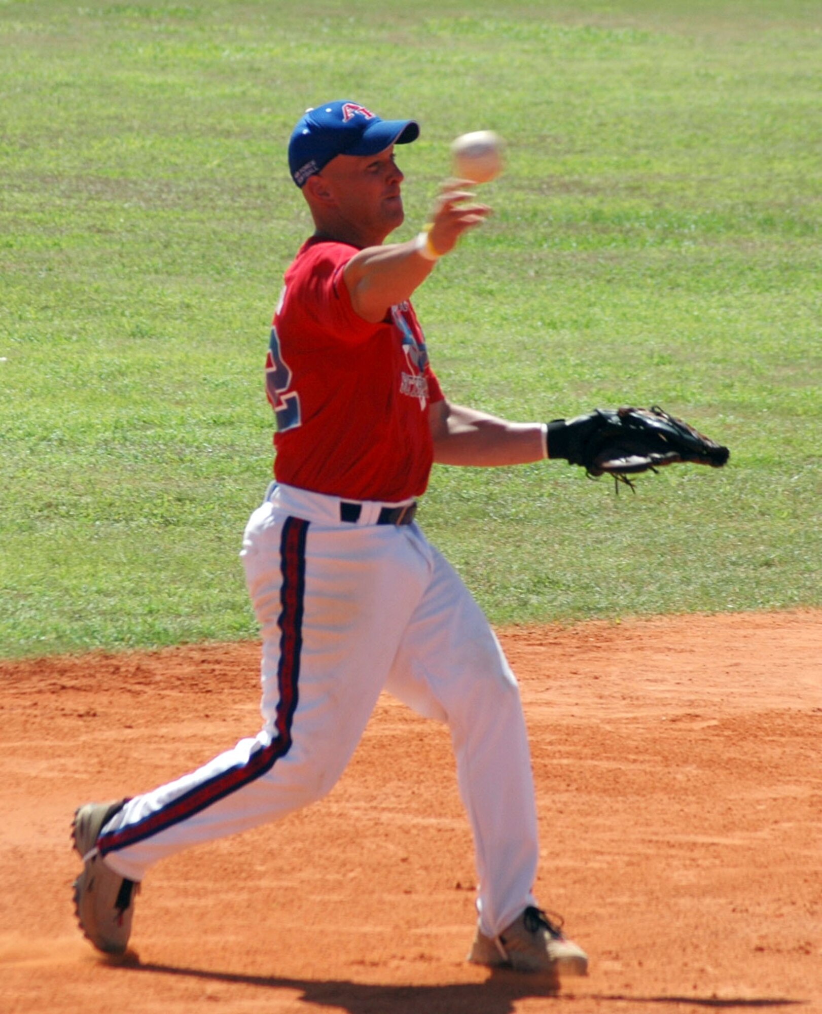 EGLIN AIR FORCE BASE, Fla. -- Third baseman Daniel Simpson throws out an Army runner in their second matchup of the 2005 Armed Forces Men's Softball Championships held here Sept. 7 to 9.  Air Force defeated Army 12-5.  (U.S. Air Force photo by Staff Sgt. Ryan Hansen)
