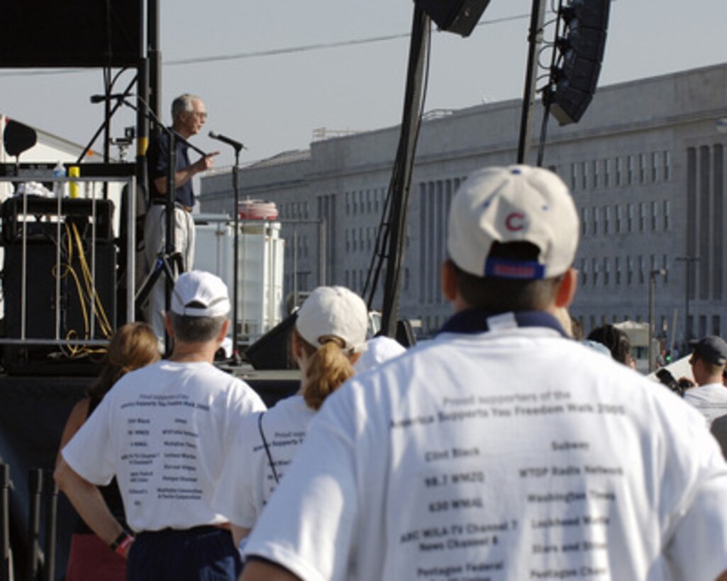 Acting Deputy Secretary of Defense Gordon England speaks to the crowd assembled at the Pentagon to take part in the America Supports You Freedom Walk on Sept. 11, 2005. The walk was held in remembrance of the victims of Sept. 11, 2001, and to honor our servicemen and women working to preserve freedom around the world. The walk began near the Pentagon crash site, passed Arlington National Cemetery and proceeded past several National Monuments to conclude on the National Mall by the Reflecting Pool. The participants were invited to attend a musical tribute by country singer and songwriter Clint Black at the end of the walk. 