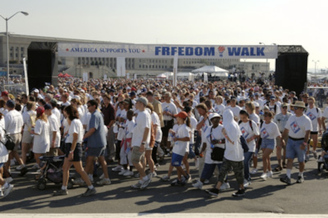 Thousands of people of all ages take part in the America Supports You Freedom Walk beginning at the Pentagon in Arlington, Va., on Sept. 11, 2005. The walk was held in remembrance of the victims of Sept. 11, 2001, and to honor our servicemen and women working to preserve freedom around the world. The walk began near the Pentagon crash site, passed Arlington National Cemetery and proceeded past several National Monuments to conclude on the National Mall by the Reflecting Pool. The participants were invited to attend a musical tribute by country singer and songwriter Clint Black at the end of the walk. 
