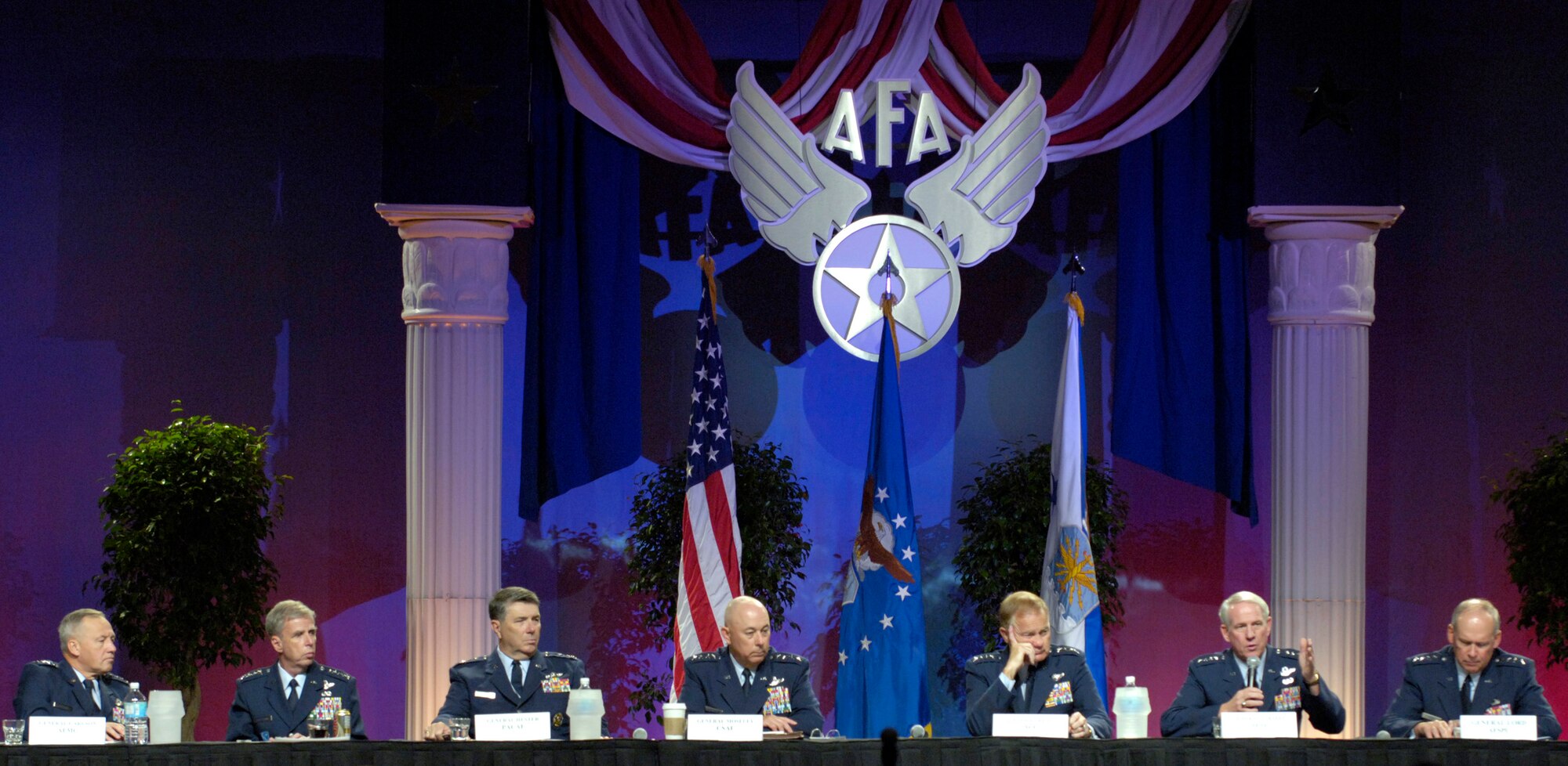 WASHINGTON -- Gen. William R. Looney (second from right), commander of Air Education and Training Command, talks about the effects of hurricane Katrina on Keesler Air Force Base, Miss., during a four star forum moderated by Air Force Chief of Staff Gen. T. Michael Moseley on the second day of the Air Force Association's 2005 Air and Space Conference and Technology Exposition Sept. 13 in Washington, D.C.  The panel consisted of (from left) Gen. Bruce Carlson, AFMC; Gen. Robert H. &quot;Doc&quot; Foglesong, USAFE; Gen. Paul V. Hester, PACAF; General Moseley, Gen. Ronald E. Keys, ACC; General Looney; and Gen. Lance W. Lord, AFSPC.  (U.S. Air Force photo by Master Sgt. Jim Varhegyi)