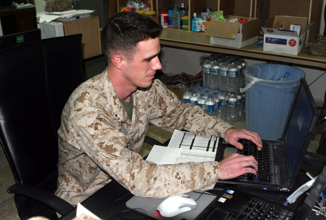 AL ASAD, Iraq ? Major Marion D. Jones, executive officer for Marine Aviation Logistics Squadron 26, speaks with Sailors of the Mobile Air Cargo Handling team.  The outgoing MACH III team was rewarded for their work in Iraq.