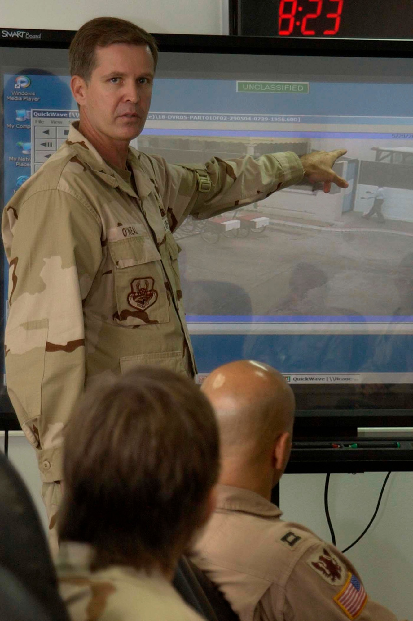 SOUTHWEST ASIA -- Lt. Col. Ed O’Neal briefs Airmen on tactics and techniques for survival at a forward-deployed location. In his briefings, the colonel takes lessons learned from his actions during a vicious terrorist attack in Saudi Arabia in 2004. He uses surveillance footage from the compound’s cameras where the attack occurred as visual aids during the briefing that show the terrorists in action and him getting shot. Colonel O’Neal is the U.S. Central Air Forces director of manpower and personnel. (U.S. Air Force photo by Capt. David Small) 