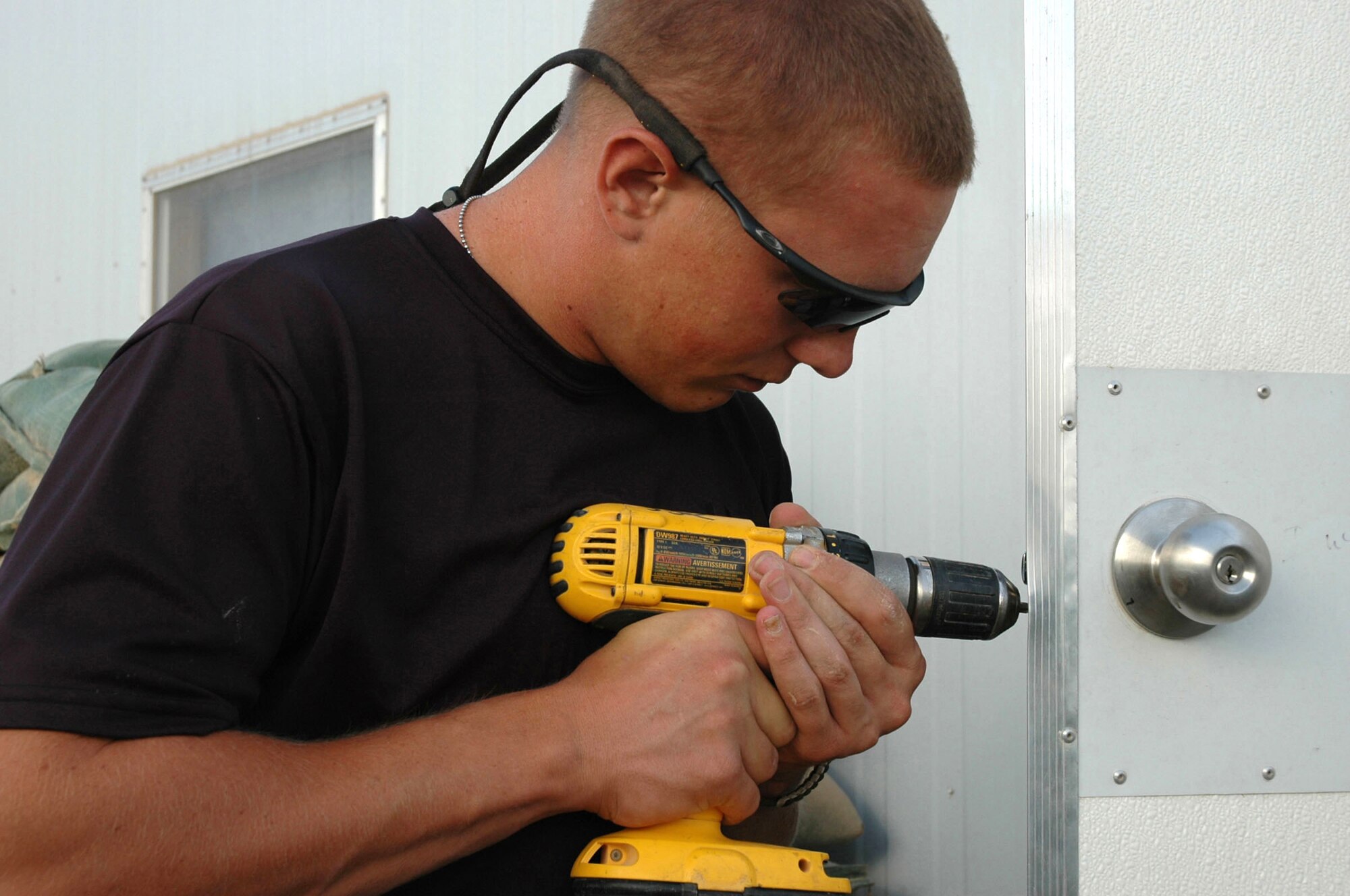 BALAD AIR BASE, Iraq -- Airman 1st Class Justin Jones works to improve the quality of life for people here.  He is assigned to the 332nd Expeditionary Civil Engineer Squadron's equipment and pavements flight and is deployed from Shaw Air Force Base, S.C.  (U.S. Air Force photo by Senior Airman Chawntain Sloan)